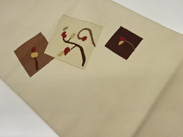 Nagoya obi woven with a square, branch, and fruit pattern